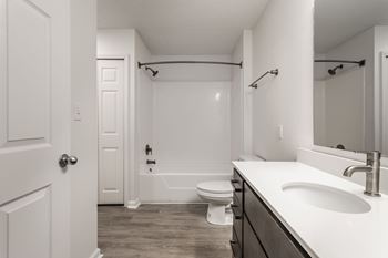 a bathroom with a sink and a toilet and a shower at Latitudes Apartments, Indianapolis, Indiana